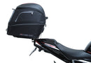 Image showing the Ventura EVO-12 Bike-Pack Kit for Triumph Speed Triple 1200 RS, RR (21 ->), featuring a black EVO-12 Pack tail bag, Evo-Rack Top-Box Rack, and an L-Bracket with screws and mounting hardware.