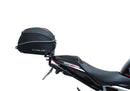 Image showing the Ventura EVO-12 Bike-Pack Kit for Triumph Speed Triple 1200 RS, RR (21 ->), featuring a black EVO-12 Pack tail bag, Evo-Rack Top-Box Rack, and an L-Bracket with screws and mounting hardware.