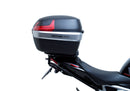 Image showing the Ventura EVO-12 Bike-Pack Kit for Triumph Speed Triple 1200 RS, RR (21 ->), featuring a black EVO-12 Pack tail bag, Evo-Rack Top-Box Rack, and an L-Bracket with screws and mounting hardware.