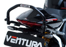 Image showing the Ventura EVO-12 Bike-Pack Kit for Triumph Speed Triple 1200 RS, RR (21 ->), featuring a black EVO-12 Pack tail bag, Evo-Rack Top-Box Rack, and an L-Bracket with screws and mounting hardware.