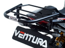 Image showing the Ventura EVO-12 Bike-Pack Kit for Triumph Speed Triple 1200 RS, RR (21 ->), featuring a black EVO-12 Pack tail bag, Evo-Rack Top-Box Rack, and an L-Bracket with screws and mounting hardware.