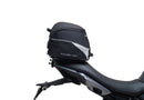Image shows a Ventura EVO-12 bike pack, Adjustable Pack-Rack, and labeled "L-Bracket" with mounting hardware on a Triumph Tiger Sport 660 (22 ->), displayed as a bike-pack kit. Text labels identify each Ventura component.