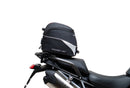 Ventura EVO-12 Bike-Pack Kit for Triumph Tiger 1200GT/Pro/Explorer (22->) includes a black EVO-12 pack, Adjustable Pack-Rack (EVO-RACK) mounted on the bike, and a labeled L-Bracket with screws.