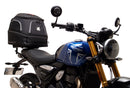 Image showing three components for the Ventura EVO-12 Bike-Pack Kit on a Triumph Scrambler 400X (24->): the EVO-12 pack (black bag), EVO-rack Sport-Rack (metal rack), and L-Bracket with hardware, each labeled with text.