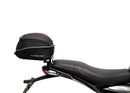 Image showing three components for the Ventura EVO-12 Bike-Pack Kit on a Triumph Scrambler 400X (24->): the EVO-12 pack (black bag), EVO-rack Sport-Rack (metal rack), and L-Bracket with hardware, each labeled with text.