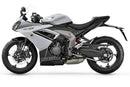 Ventura's EVO-12 Bike-Pack Kit for Triumph Daytona 660 (24 - >) includes a black zippered bike-pack, metal rear rack like the Evo-Rack, and metal L-brackets with screws depicted as a generic image.