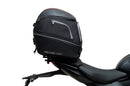 Ventura's EVO-12 Bike-Pack Kit for Triumph Daytona 660 (24 - >) includes a black zippered bike-pack, metal rear rack like the Evo-Rack, and metal L-brackets with screws depicted as a generic image.