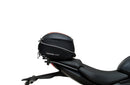 Ventura's EVO-12 Bike-Pack Kit for Triumph Daytona 660 (24 - >) includes a black zippered bike-pack, metal rear rack like the Evo-Rack, and metal L-brackets with screws depicted as a generic image.