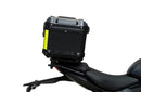 Ventura's EVO-12 Bike-Pack Kit for Triumph Daytona 660 (24 - >) includes a black zippered bike-pack, metal rear rack like the Evo-Rack, and metal L-brackets with screws depicted as a generic image.