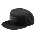 The Troy Lee Designs FLAT BILL SNAPBACK FACTORY BLACK is a black flat-brim snapback hat with a stitched rectangular "Troy Lee Designs" patch on the front, shown against a plain white background.