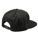 The Troy Lee Designs FLAT BILL SNAPBACK FACTORY BLACK is a black flat-brim snapback hat with a stitched rectangular "Troy Lee Designs" patch on the front, shown against a plain white background.