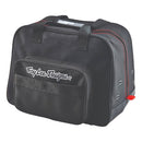 The Troy Lee Designs PREMIUM HELMET BAG BLACK features red stitching, a white front logo, zippered front pocket, mesh detailing, top handles, and silver side grommets for ventilation.
