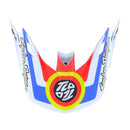The Troy Lee Designs SE5 VISOR DROP IN WHITE features bold red, blue, yellow, and white graphics with "Troy Lee Designs" text on each side and a central circular logo for a striking look.