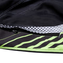 The Troy Lee Designs GP PRO AIR PANT BANDS PHANTOM/GRAY features a geometric black, gray, white, and neon green design with mesh polyester construction, mesh panels, and a thigh logo. Pants are shown laid flat on a white background.