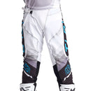 The Troy Lee Designs SE ULTRA PANT REVERB BLACK / BLUE features black, white, and gray with blue accents, "TLD" on the side, 4-way stretch fabric, reinforced knees, and ventilated perforations for comfort.