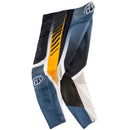 The Troy Lee Designs GP PRO AIR PANT BANDS DARK NAVY features bold geometric patterns in blue, white, black, yellow, and gray, with mesh polyester for ventilation, durable 600D polyester fabric, and a thigh logo.