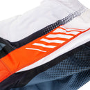 The Troy Lee Designs GP PRO AIR PANT BANDS in WHITE/INDIGO are motocross pants with geometric patterns and logo on thigh and hip, plus 600D reinforced seat panels for durability. Shown laid flat on a white background.