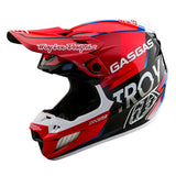The SE5 ECE Composite Helmet GASGAS Fumes Red/Black by Troy Lee Designs features a full-face, aerodynamic design in red/black with white and blue accents, plus "Troy Lee Designs" and "GASGAS" logos on the sides and visor.