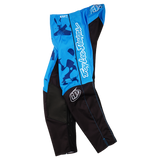 The Troy Lee Designs YOUTH GP PRO PANT BLOTTED BRIGHT BLUE features blue and black colors, white "Troy Lee Designs" lettering on the side, a logo patch on the thigh, graphic patterns, reinforced knees, and extra-durable panels.