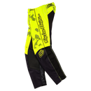 The Troy Lee Designs YOUTH GP PRO PANT BLOTTED FLO YELLOW features bold yellow and black colors, side logo text, abstract upper patterns, and reinforced panels for lasting durability on the motocross track.