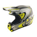 The Troy Lee Designs GP PRO HELMET CROSSOVER GRAY / FLO YELLOW is a lightweight motocross helmet with black, white, grey, and yellow angular graphics, "Troy Lee Designs" on the visor, and advanced Mips brain protection for enhanced safety.