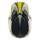 The Troy Lee Designs GP PRO HELMET CROSSOVER GRAY / FLO YELLOW is a lightweight motocross helmet with black, white, grey, and yellow angular graphics, "Troy Lee Designs" on the visor, and advanced Mips brain protection for enhanced safety.