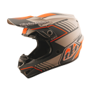 The Troy Lee Designs GP PRO HELMET SEGMENT TAUPE is a lightweight motocross helmet in black, orange, and gray geometric patterns with angular accents, "Troy Lee Designs" logo on the visor, and emergency cheek pads, shown on a white background.