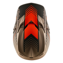 The Troy Lee Designs GP PRO HELMET SEGMENT TAUPE is a lightweight motocross helmet in black, orange, and gray geometric patterns with angular accents, "Troy Lee Designs" logo on the visor, and emergency cheek pads, shown on a white background.