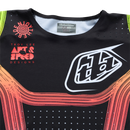 The SE PRO JERSEY STRIPES BLACK / MULTI by Troy Lee Designs is a long-sleeve black athletic jersey with vibrant rainbow stripes and white logos—ideal for any SE Pro motocross kit.