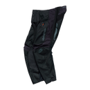 The Troy Lee Designs SCOUT GP PRO PANT MONO BLACK features zipper pockets, reinforced knees, and logo details on the thigh and hip—a durable choice for trail riding, shown here in black against a white background.