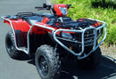 A red Ventura Honda TRX 520 FM1, FM2, FE2 ATV with large tires and a silver metal bumper with bull-bars is parked on a paved road beside green grass and bushes.