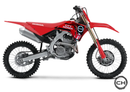 Red Honda dirt bike on a white background
