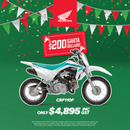 A Honda CRF110F White/Aqua shown in a side view. The bike features knobby tires, a compact frame, and is designed for off-road usage, perfect for navigating through gardens and lawns.