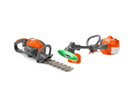 Two orange and gray gardening toys from the Husqvarna Toy Hedge Trimmer & Weed Trimmer Bundle by Husqvarna Toys are displayed against a white background. The tool on the left is a toy hedge trimmer, while the tool on the right resembles a power blender with a green top. Both toys have visible handles and blades, creating a playful setup for garden enthusiasts.