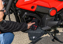 The Honda NAVi NVA110, by Honda, is a vibrant red mini motorcycle that emphasizes urban mobility with its compact design. It features a sleek black seat and the iconic Honda logo prominently displayed on its fuel tank. Equipped with thick black wheels and a short exhaust, this model expertly combines elements of a scooter and motorcycle to create an efficient ride ideal for city streets.