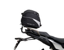 Ventura EVO-12 Bike-Pack Kit for Yamaha Tracer 900 GT (19-21) includes a black EVO-12 pack, an EVO-RACK Top-Box Rack, and an L-Bracket with screws/bolts, each item labeled with a red tag.