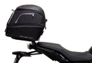 The Ventura EVO-12 Bike-Pack Kit for Yamaha Tracer 7 (23>) includes a black tail bag, EVO-RACK metal Sport-Rack, L-brackets with screws, all shown on a white background with product labels.