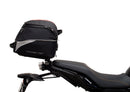 The Ventura EVO-12 Bike-Pack Kit for Yamaha Tracer 7 (23>) includes a black tail bag, EVO-RACK metal Sport-Rack, L-brackets with screws, all shown on a white background with product labels.