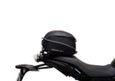 The Ventura EVO-12 Bike-Pack Kit for Yamaha Tracer 7 (23>) includes a black tail bag, EVO-RACK metal Sport-Rack, L-brackets with screws, all shown on a white background with product labels.