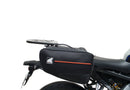Image showing the Ventura EVO-12 Bike-Pack Kit for Yamaha MT-09, SP, Y-AMT (24->), with three labeled items: EVO-12 Pack (compact black bag), Evo-Rack (metal pack-rack on bike), and L-Bracket (black brackets with screws).