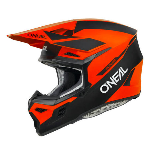 The O'Neal 2025 3SRS RACE Helmet in black and red showcases an angular design complete with a visor, constructed from a robust polycarbonate shell. The brand "ONEAL" is prominently featured in white lettering on the side. Inside, there's a speckled gray lining visible, and ventilation ensures comfort for every ride.