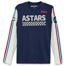 The Alpinestars Stadium Long Sleeve Tee by Crown Kiwi Enterprises Limited is a high-quality long sleeve tee in navy blue, crafted from 100% cotton. It features a printed "ASTARS" chest logo with a checkered pattern and the number "1963." The off-white sleeves are adorned with red and blue stripes and complemented by patches near the shoulders.