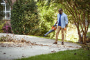 The Husqvarna 230iB Leaf Blower skin, featuring a brushless motor for enhanced efficiency, showcases a sleek orange design with black and gray accents. The "Husqvarna" name is proudly displayed on the tube, and its ergonomic handle ensures comfortable operation.