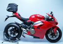 Image displaying Ducati 1100 Panigale V4 accessories by Ventura: at the top, a sleek black EVO-12 pack; on a bike, an Evo-Rack securely fastened; below, an L-Bracket set with screws. Accompanied by the text "Generic Image.