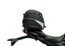 Image showcasing a Ventura EVO-12 Bike-Pack Kit containing three components: a black and gray EVO-12 pack with zipper, an Evo-Rack on a Honda CB 650R/CBR 650R (19-20) for stability, and L-brackets with screws, all in this generic image.