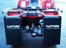 A red Ventura Honda ATV TRX 250 TE, TM (17 - >) with a personalized company logo and a silver front metal guard is parked on wet pavement. Green shrubs frame the background, while a car is partially visible on the right.