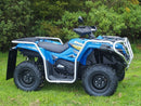 A Ventura CF Moto ATV X500EPS (2017) in blue with black wheels, sturdy bull-bars, and protective silver bars is parked on green grass, backed by dense green bushes.
