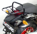 Image showcasing the Ventura EVO-12 Bike-Pack Kit. Featuring a black EVO-12 pack with orange accents, an Adjustable Pack-Rack securely attached to a Ducati 916 Monster S4 (01-03), and a generic L-bracket with screws, all labeled in striking red text for easy identification.