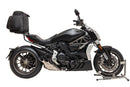 The image of the Ducati 1200 X Diavel (16-18) by Ventura features a cushioned black pack labeled 'EVO-12 PACK', an 'Adjustable Pack-Rack' mounted to a bike, an L-bracket labeled 'Generic Image', and bolts and washers, all set against a clean white background.