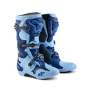 The ALPINESTARS Tech 10 Le Steeler Mx Boots feature light blue and navy colors, black buckles, textured details, and a Dynamic Heel Compression Protector for off-road riding protection and style. Inspired by the classic Tech 10 design.